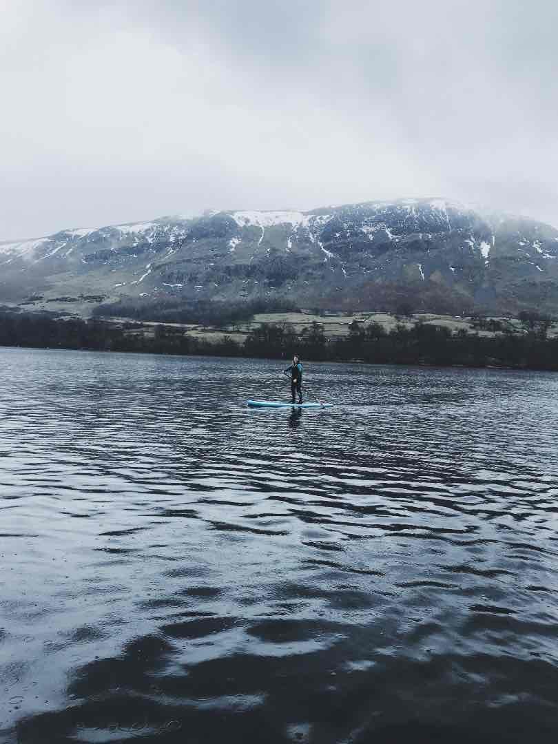 Stand up paddleboarding in the Lake District.