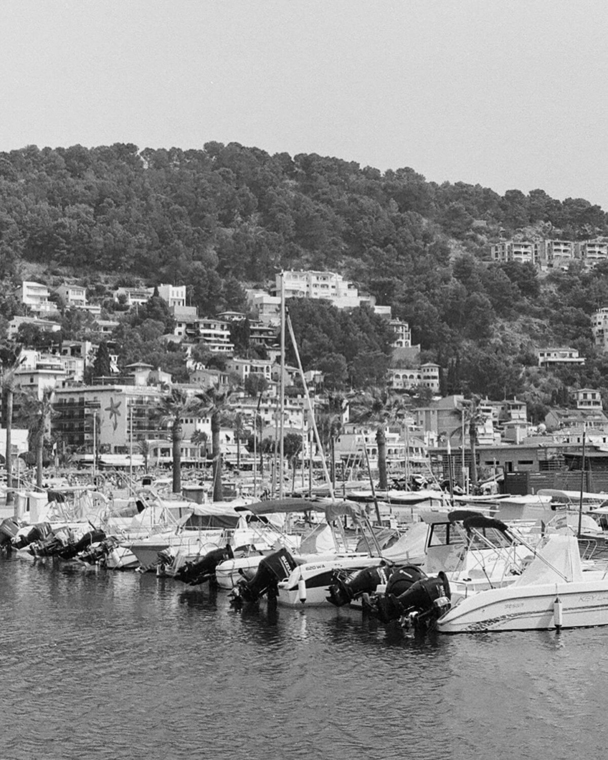 Black and white photo of boats in the harbour of Port de Soller.