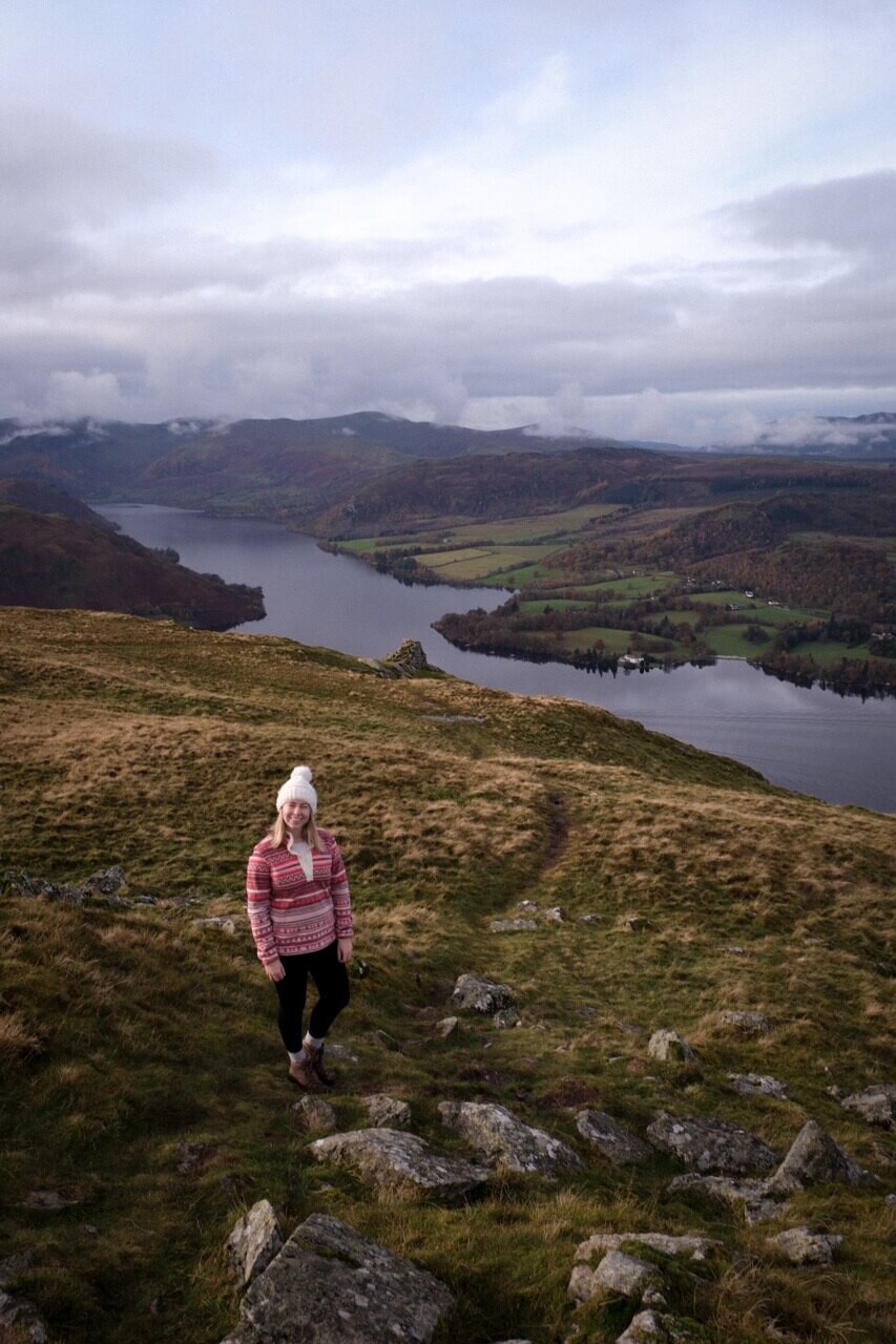 Emma stood on Arthur's Pike with view of Ullswater in the background